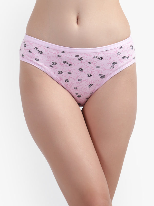 Pink floral-patterned underwear worn by a person on a white background