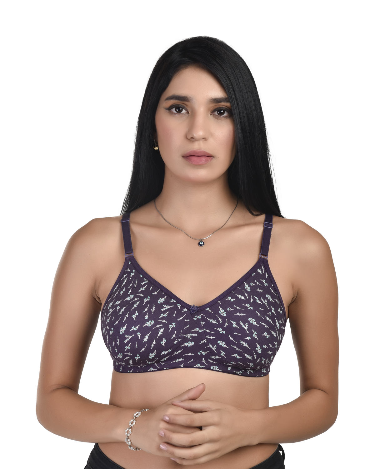 Woman wearing a purple patterned bralette on a white background