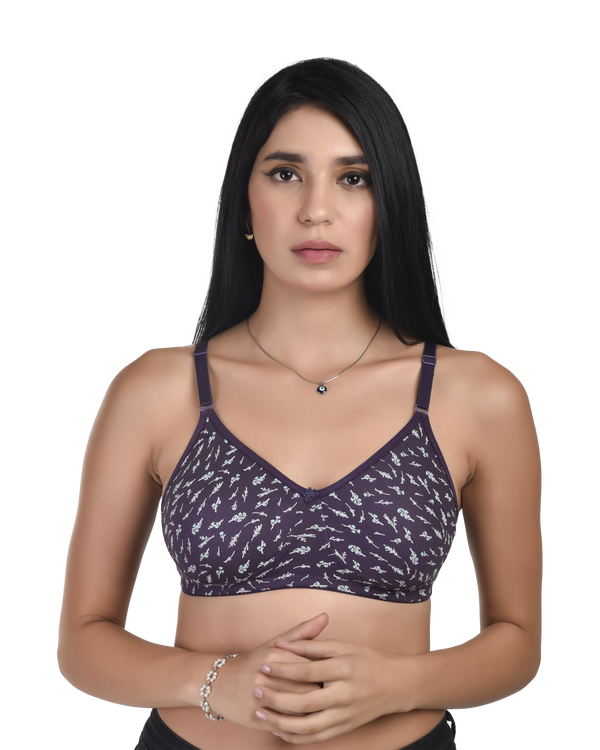 Woman wearing a purple patterned bralette on a white background