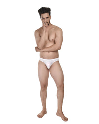 Man wearing a white cheekini brief on a white background