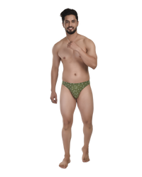 Man wearing a green patterned underwear on a white background