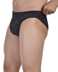 Man wearing Bruchi Club printed bikini brief in soft cotton lycra