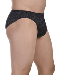 Black patterned underwear worn by a person on a white background