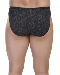 Black patterned underwear worn by a person on a white background