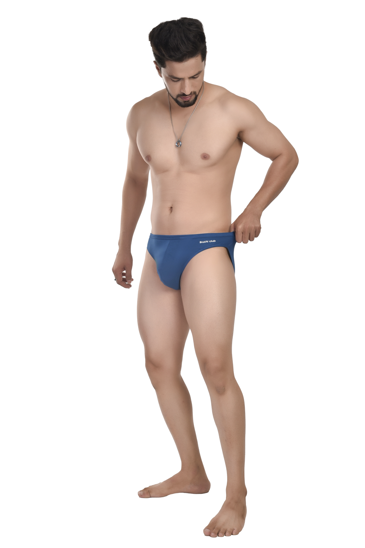 Man wearing a blue swim brief on a white background