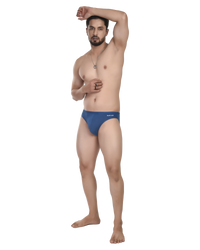 Man wearing a blue innerwear on a white background