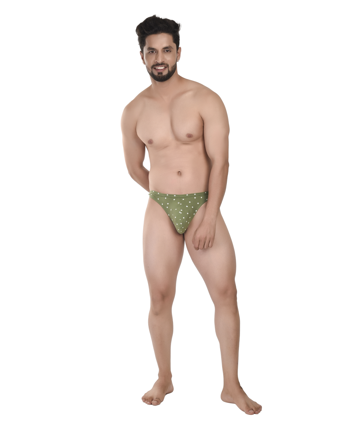 Man wearing green patterned underwear on a white background