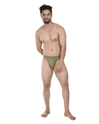 Man wearing green patterned underwear on a white background
