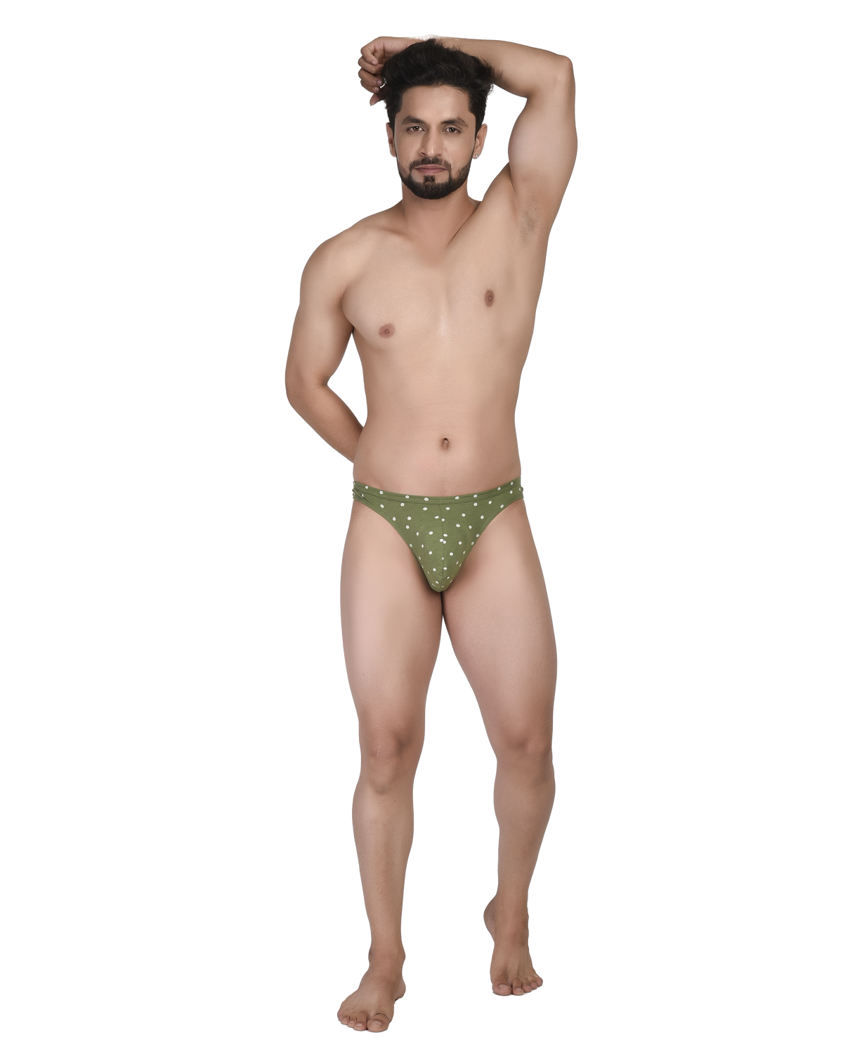 Man wearing green polka dot underwear on a white background