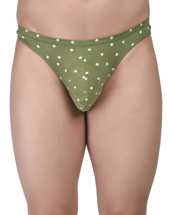 Green polka dot bikini bottom on a white background