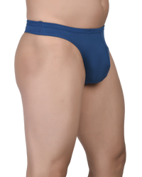 Blue thong worn by a person on a white background