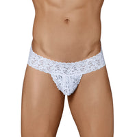 This image features a model wearing men's lace underwear, designed in a semi-seamless, elastic-free style for a comfortable fit. The underwear is crafted from a super stretch nylon fabric, predominantly in white, showcasing a luxurious see-through stretch lace pattern that emphasizes sophistication and allure.