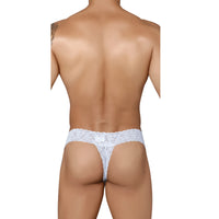 This image features a model wearing men's lace underwear, designed in a semi-seamless, elastic-free style for a comfortable fit. The underwear is crafted from a super stretch nylon fabric, predominantly in white, showcasing a luxurious see-through stretch lace pattern that emphasizes sophistication and allure.